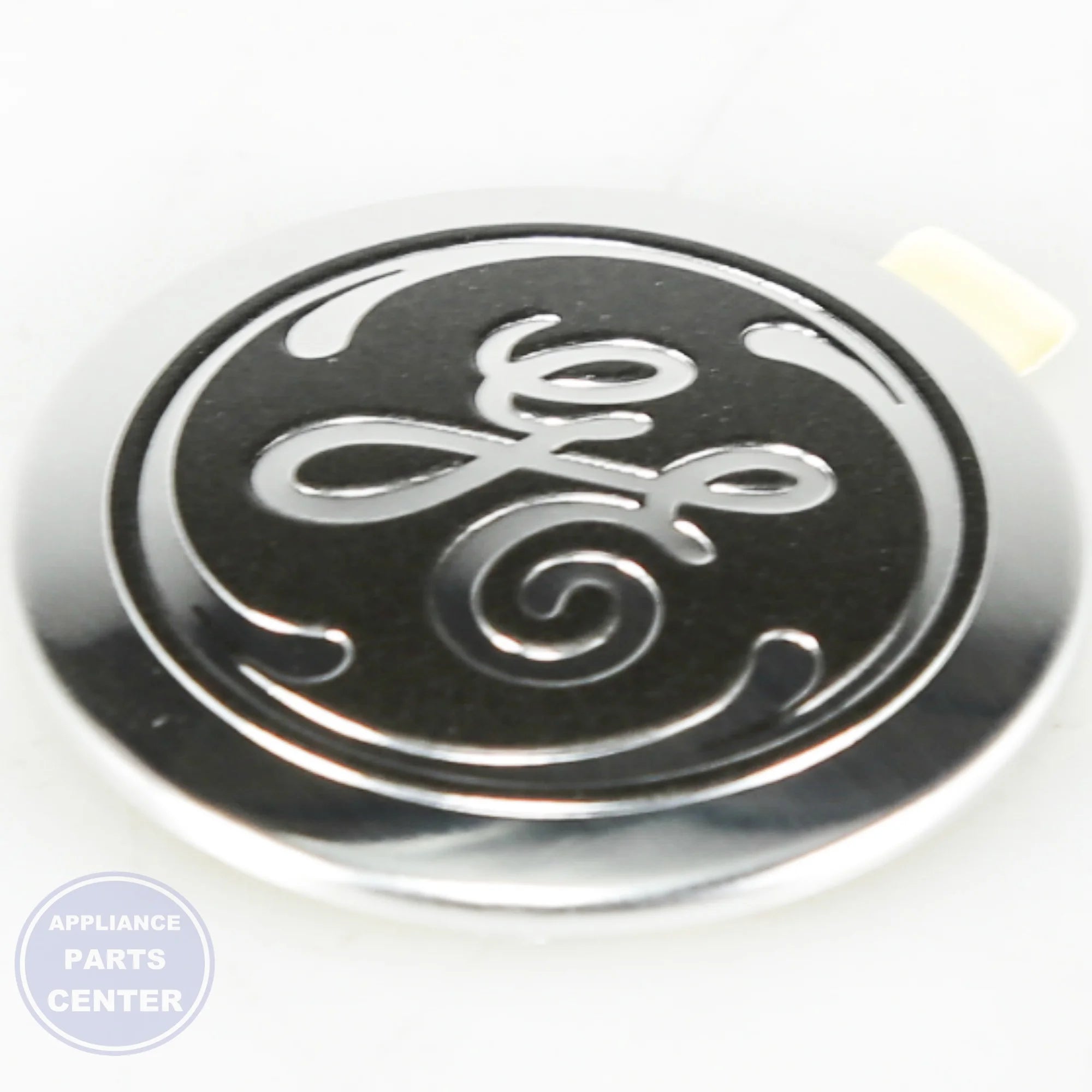 GE BADGE GE WB02T10589 - Main view showing the GE logo for specific models