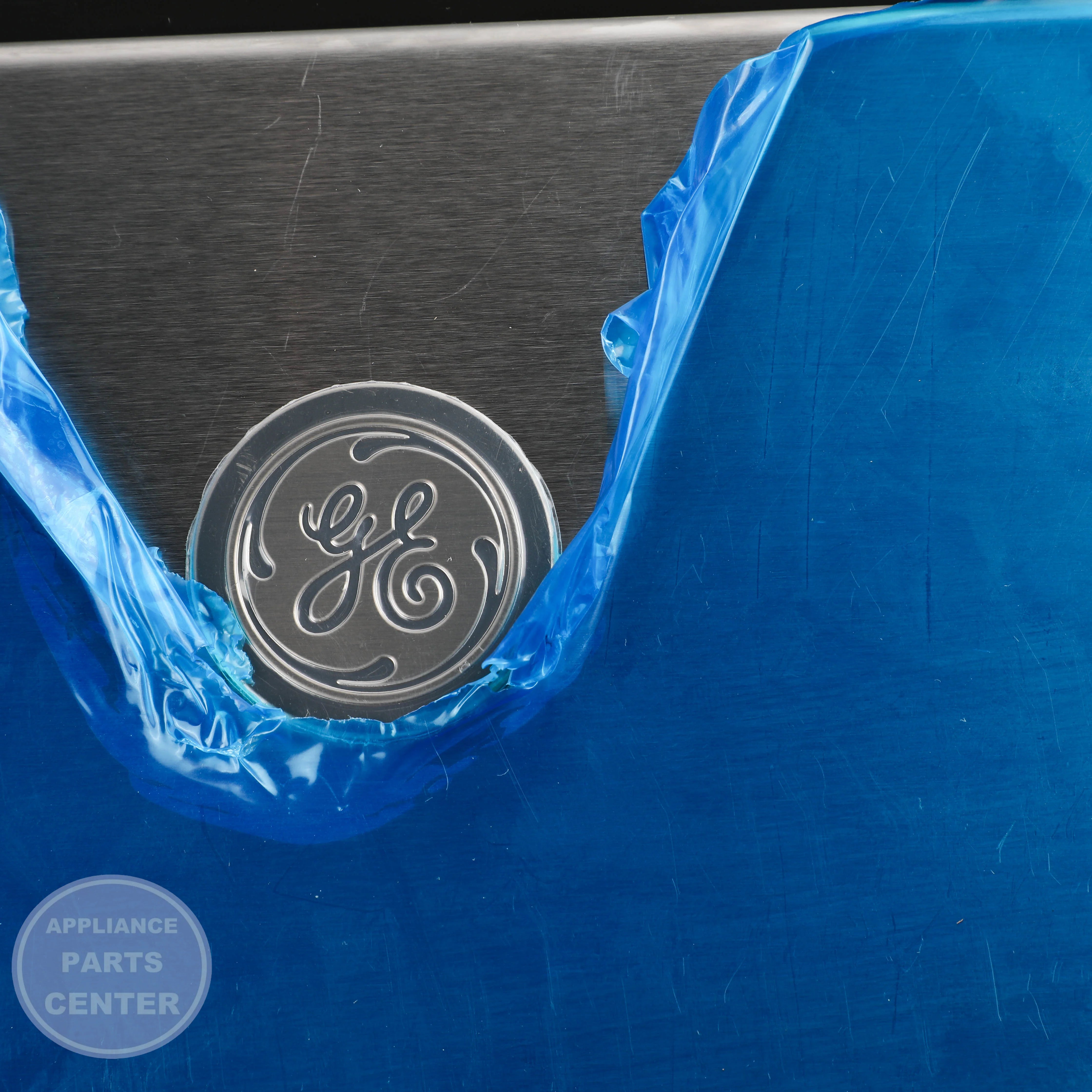 GEH RANGE GLASS OVEN DOOR WB56X24968 - Installation in specific model showing mounting points